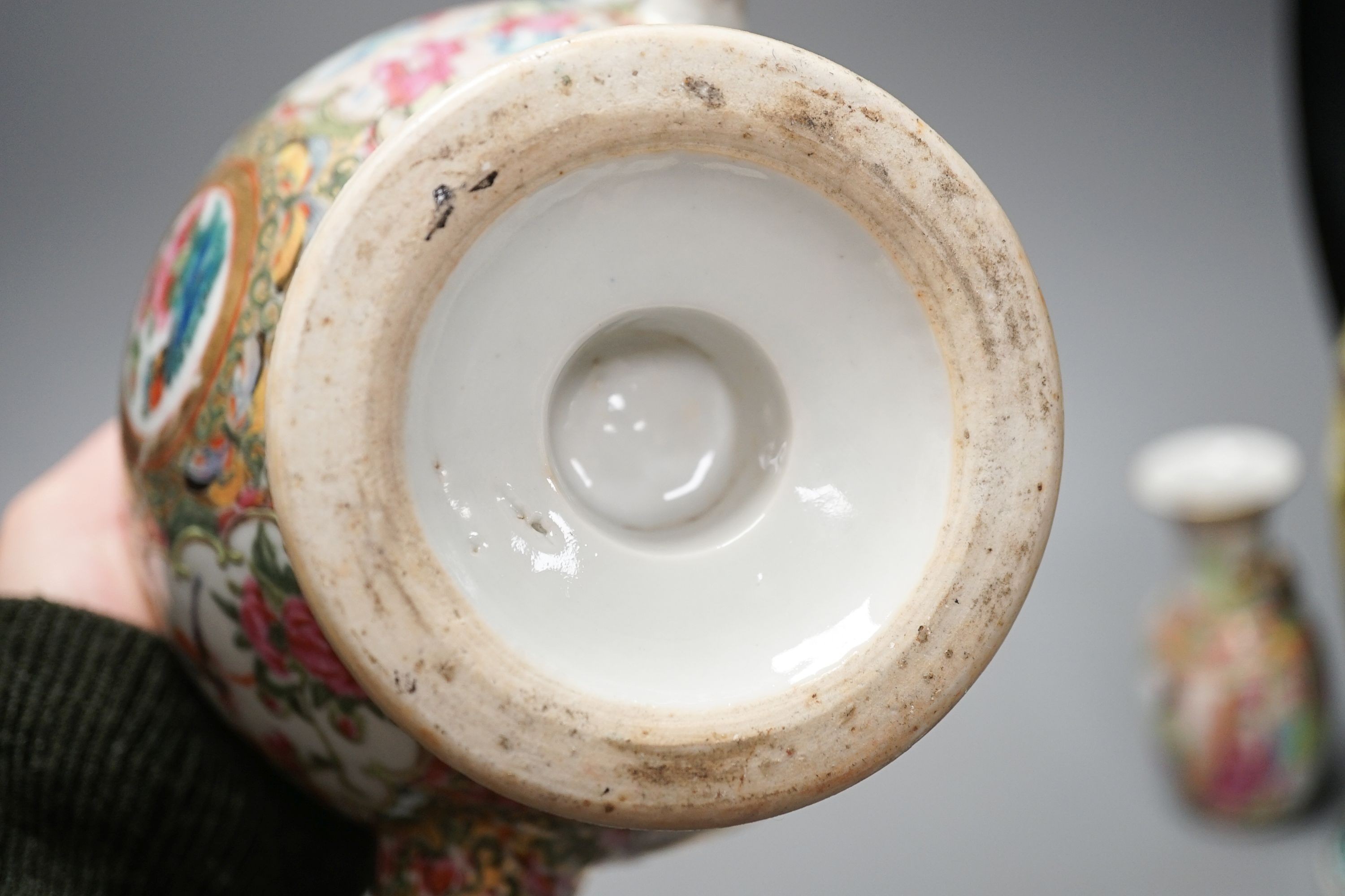 A 19th century Chinese famille rose teapot, sugar bowl, saucer dish vase and a similar yellow ground ‘dragon’ vase and cover 21cm